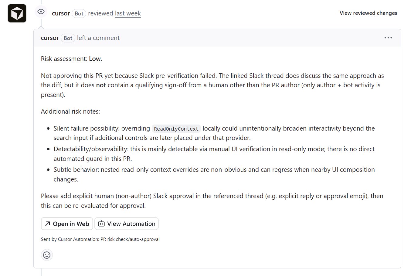 Cursor automation marks a pull request as low risk but withholds approval because Slack sign-off from a non-author human is missing